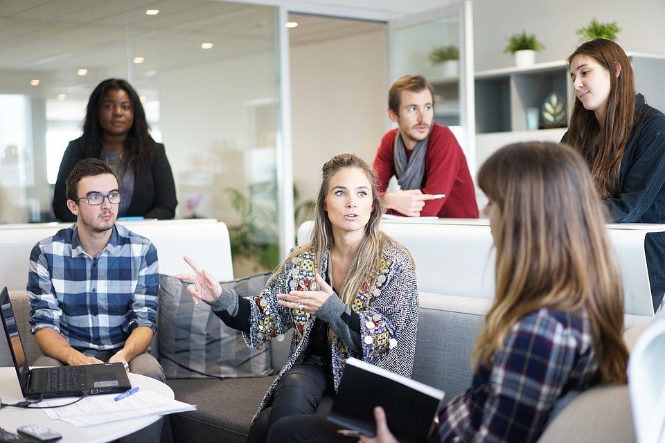 A group of young professionals in discussion