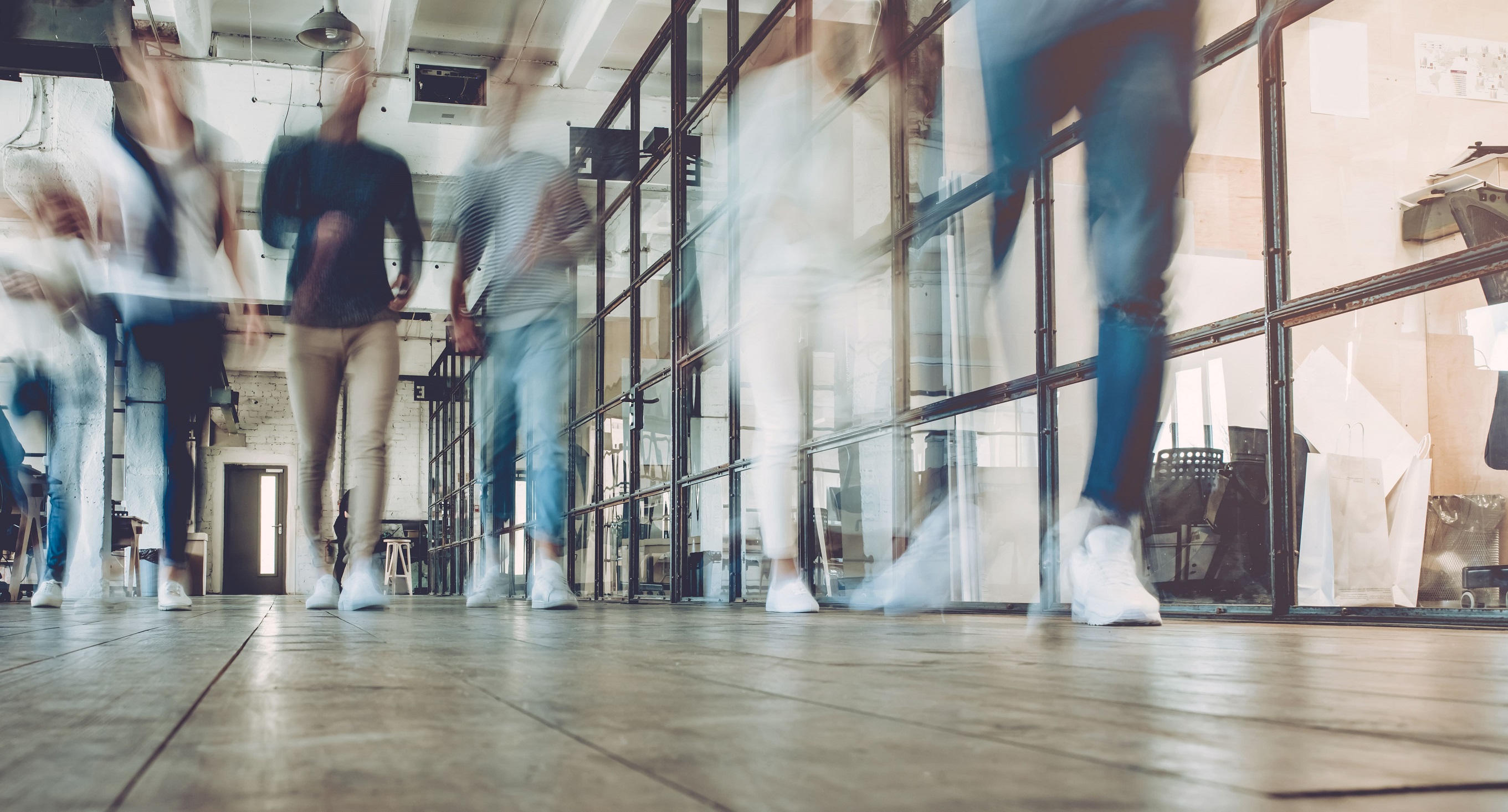 people walking in corridor